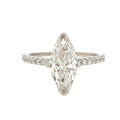 Diamond ring with a pear-shaped center stone on a white background