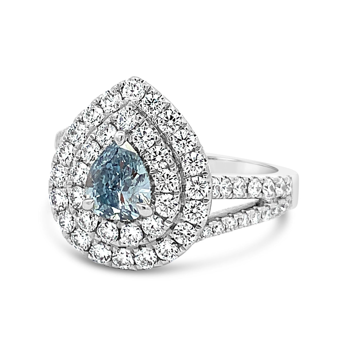 Diamond ring with a blue gemstone on a white background