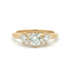 Gold ring with three diamonds on a white background