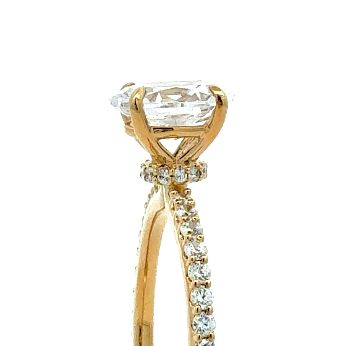 A close-up of a yellow gold ring featuring a large oval-cut clear gemstone in a prong setting, with small accent stones along the band, shown against a plain white background.