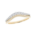 Gold ring with diamond accents on a white background