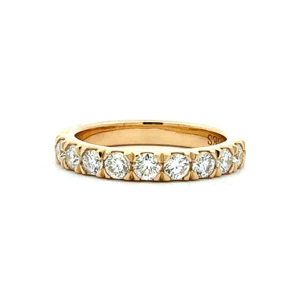 Gold ring with diamonds on a white background