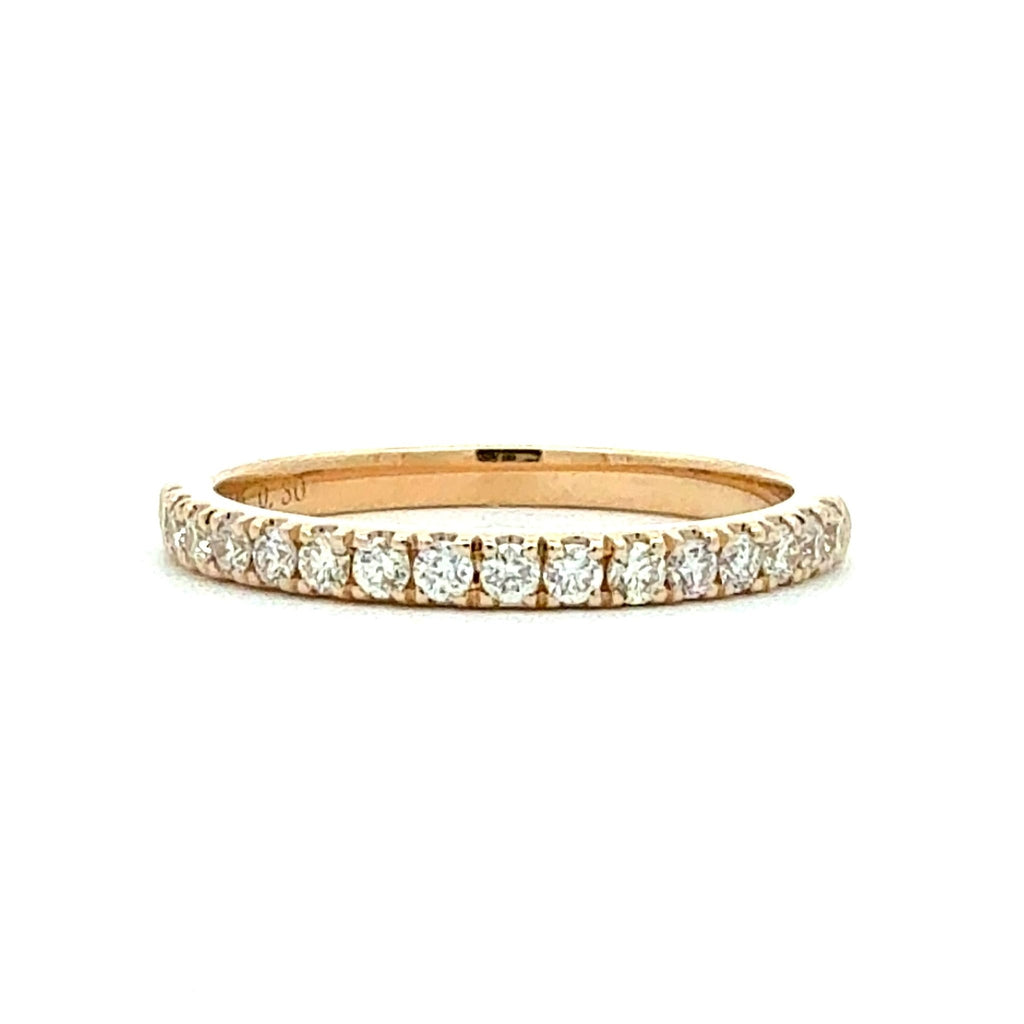 Gold ring with diamonds on a white background