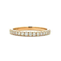 Gold ring with diamonds on a white background