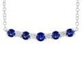Necklace with blue gemstones and clear stones on a white background