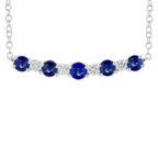 Necklace with blue gemstones and clear stones on a white background