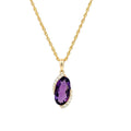 A gold chain necklace with a pendant featuring three teardrop-shaped purple gemstones arranged in a cluster, set against a plain white background.