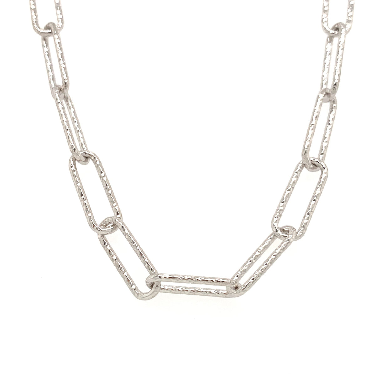 Sterling silver textured paperclip chain necklace with elongated oval links on a white background