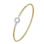 A gold braided cable bracelet with a silver-toned circular clasp adorned with small clear stones, shown on a plain white background.