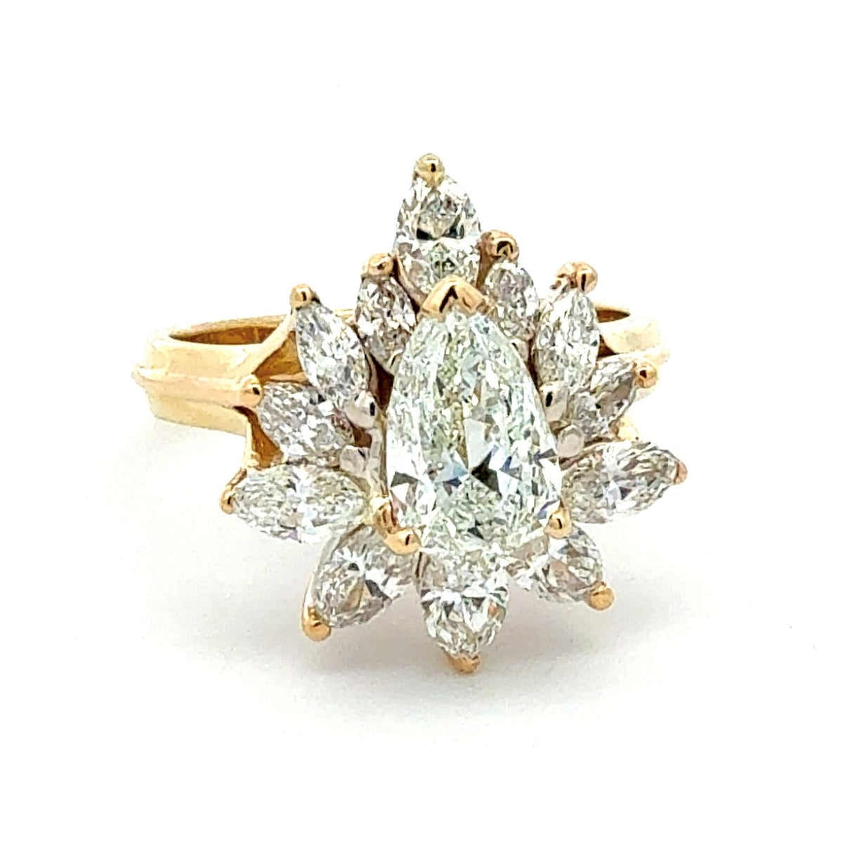 Gold ring with a central green gemstone and diamond accents on a white background