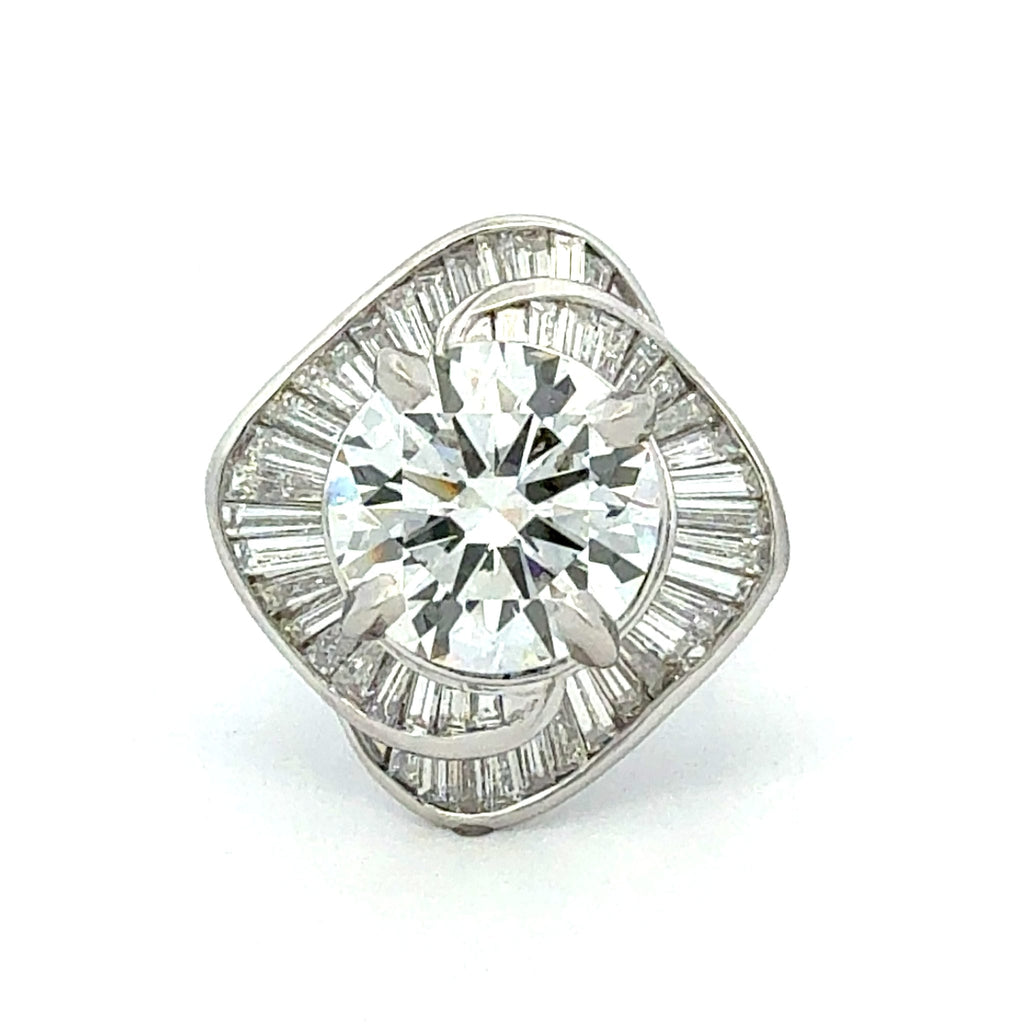 Diamond earring with baguette and round cut stones on a white background