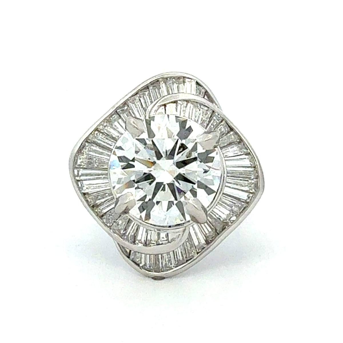 Diamond earring with baguette and round cut stones on a white background