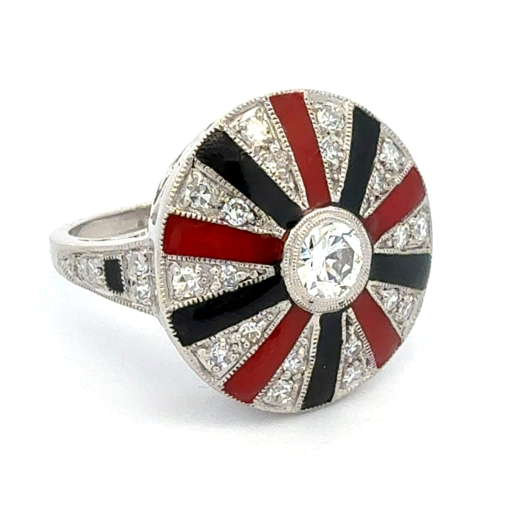 Elegant ring with red, black, and white design on a white background