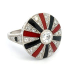 Elegant ring with red, black, and white design on a white background
