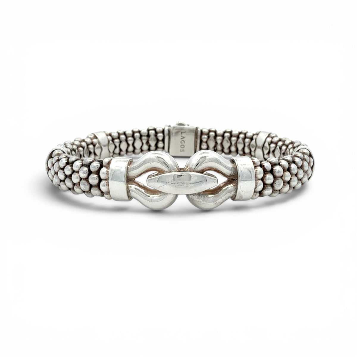 A silver-toned beaded bracelet with a central knot-like clasp and a small engraved brand tag reading 'LACOT' on the inside, shown on a clean white background.