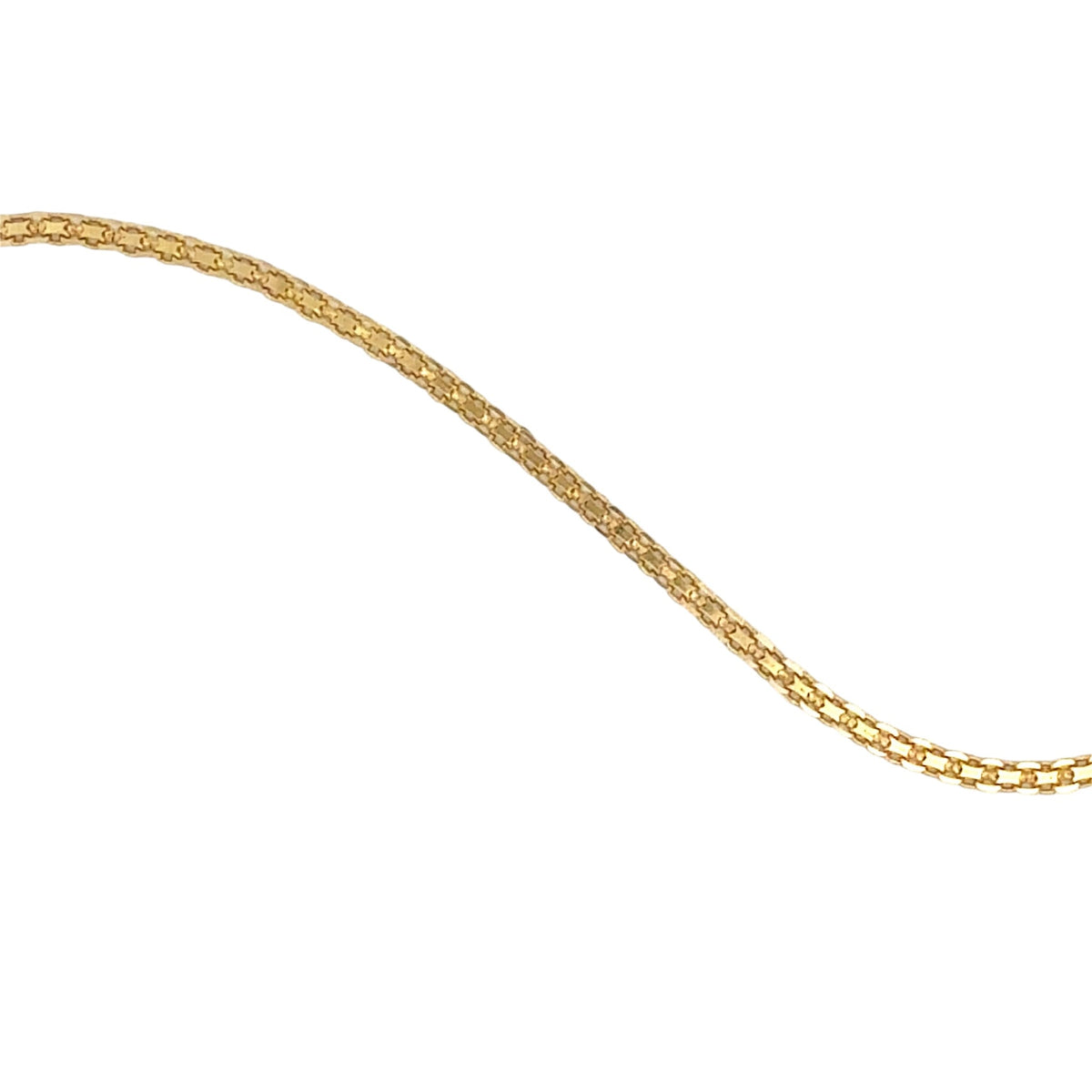 A close-up of a gold-colored chain necklace, shown in a diagonal orientation against a plain white background.