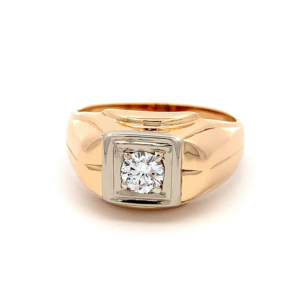 A men's signet ring featuring a square-cut diamond set in a two-tone gold and white gold or platinum bezel, mounted on a polished yellow gold band.