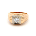 A men's signet ring featuring a square-cut diamond set in a two-tone gold and white gold or platinum bezel, mounted on a polished yellow gold band.