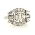 Diamond ring with a central large diamond and smaller diamonds on a white background