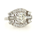 Diamond ring with a central large diamond and smaller diamonds on a white background