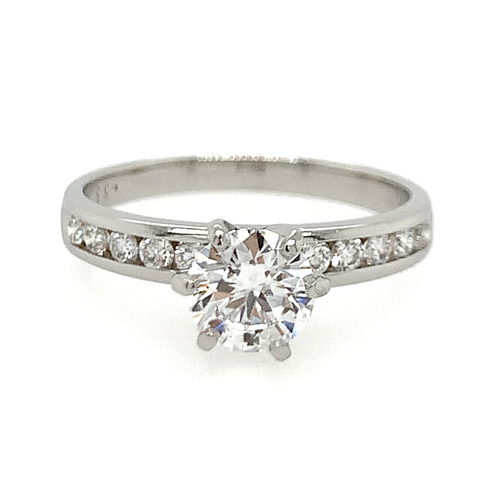 Diamond ring with a white gold band on a white background