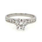 Diamond ring with a white gold band on a white background
