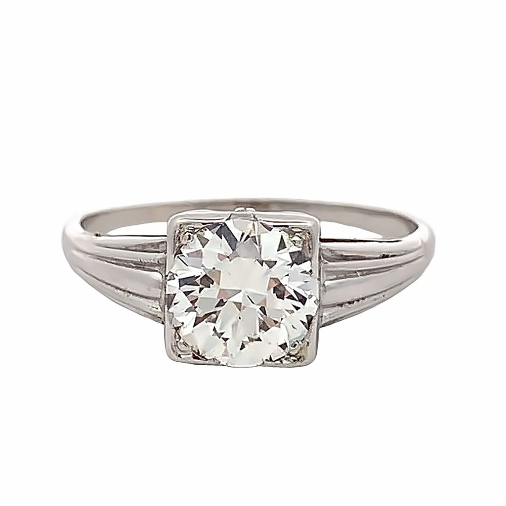 Silver ring with a large diamond on a white background