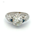 Diamond ring with intricate design on a white background