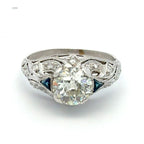 Diamond ring with intricate design on a white background