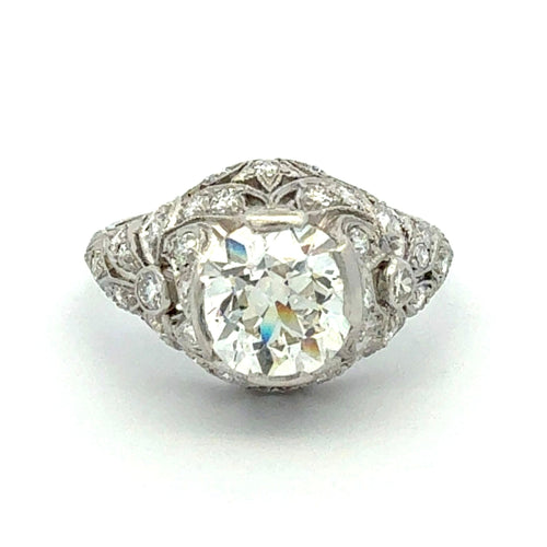 Diamond ring with intricate design on a white background