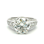 Diamond ring with a white gold band on a white background