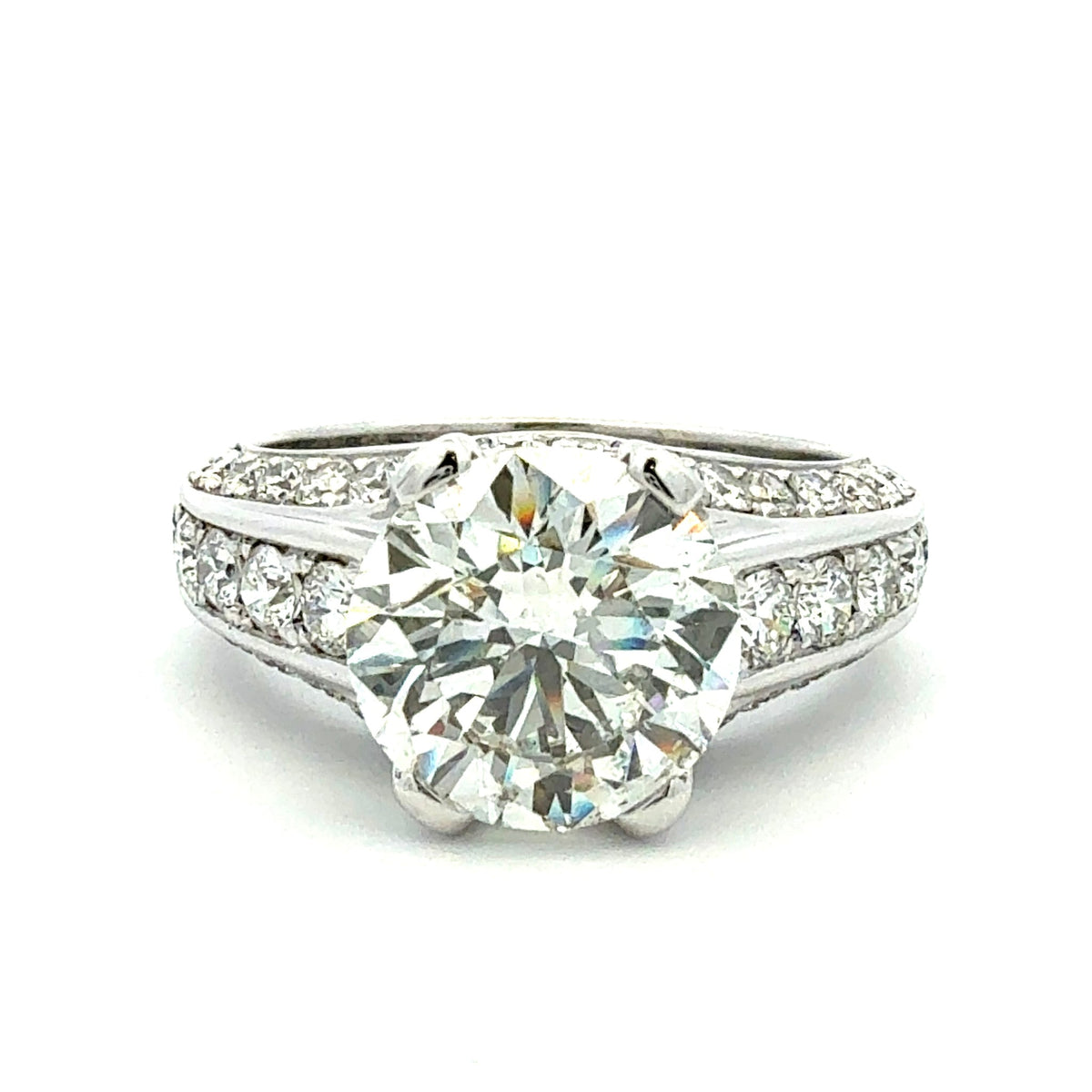 Diamond ring with a white gold band on a white background
