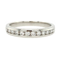 Silver ring with small diamonds on a white background