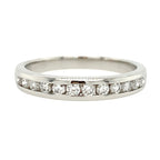 Silver ring with small diamonds on a white background