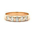 Rose gold ring with diamonds on a white background