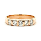 Rose gold ring with diamonds on a white background