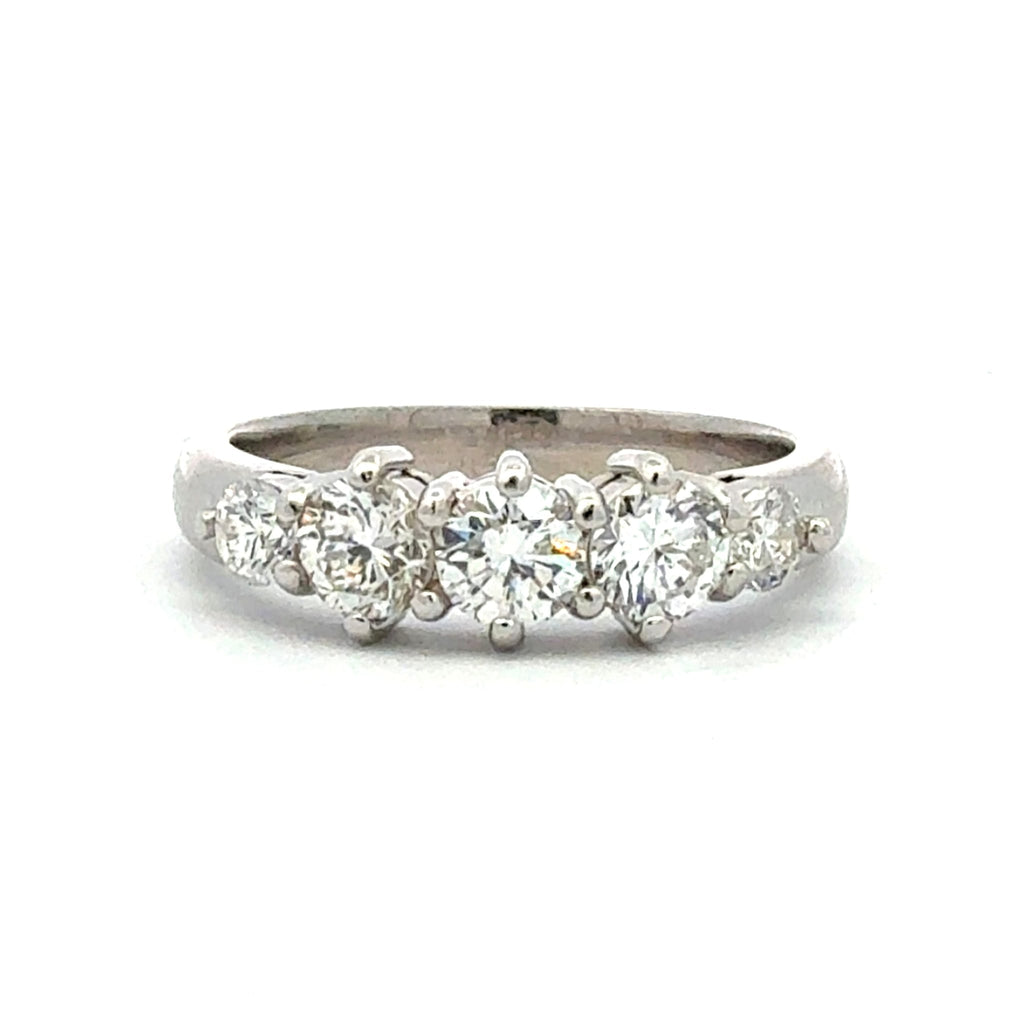 Diamond ring with five stones on a white background