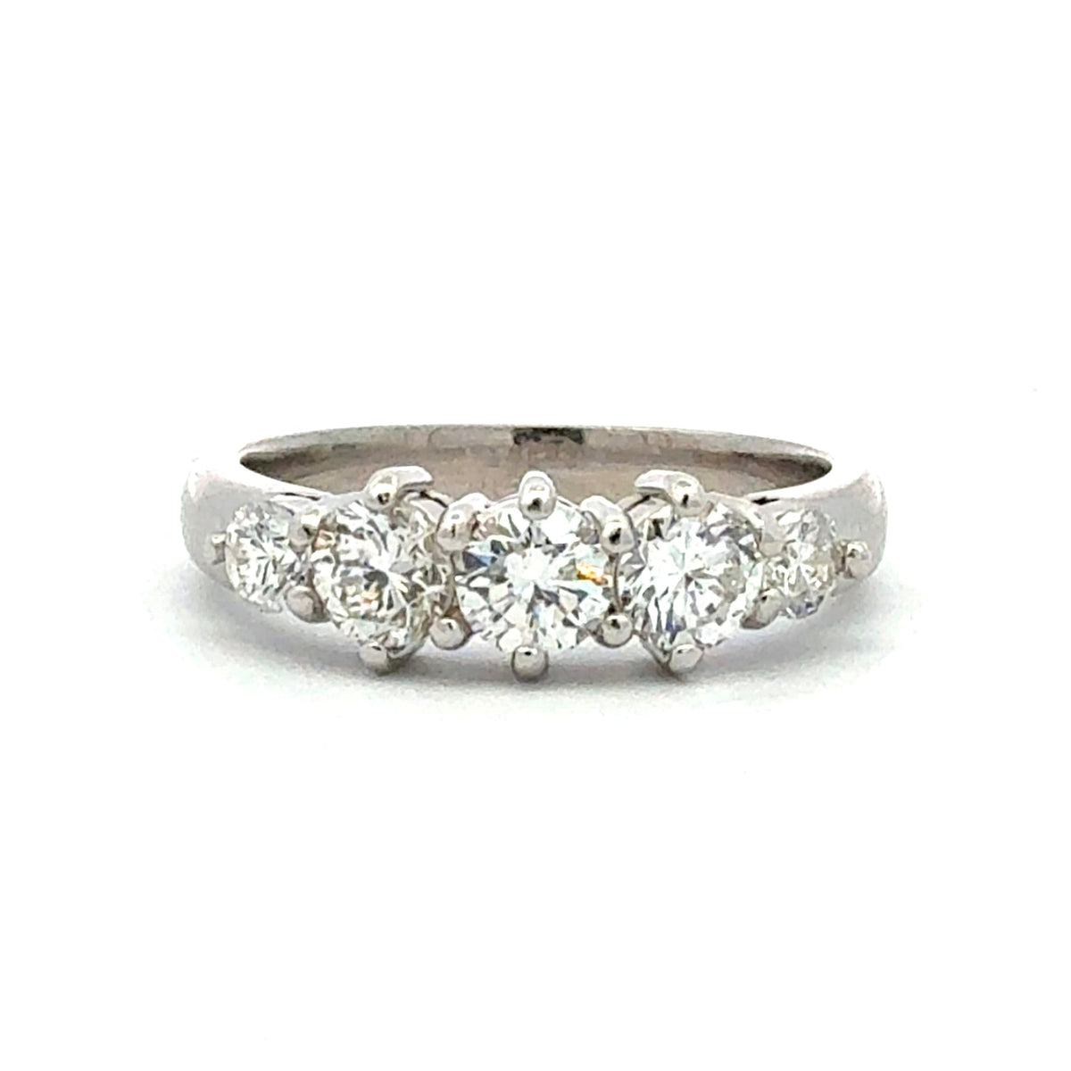 Diamond ring with five stones on a white background
