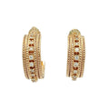 A pair of gold hoop earrings with multiple rows of textured rope-style bands and rows of small clear stones, shown on a plain white background.