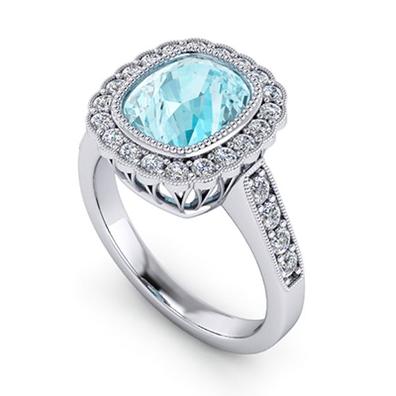 Custom blue zircon ring, angled view — Moses Jewelers