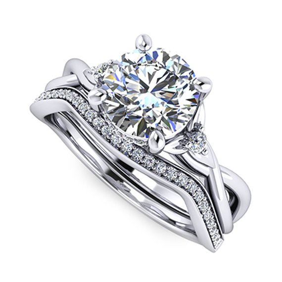 Custom engagement ring shown with one matching band — Moses Jewelers