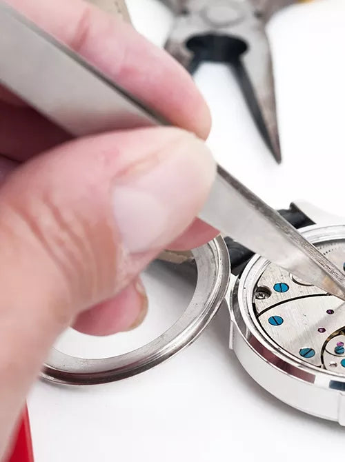 Watchmaker servicing a mechanical watch at Moses Jewelers